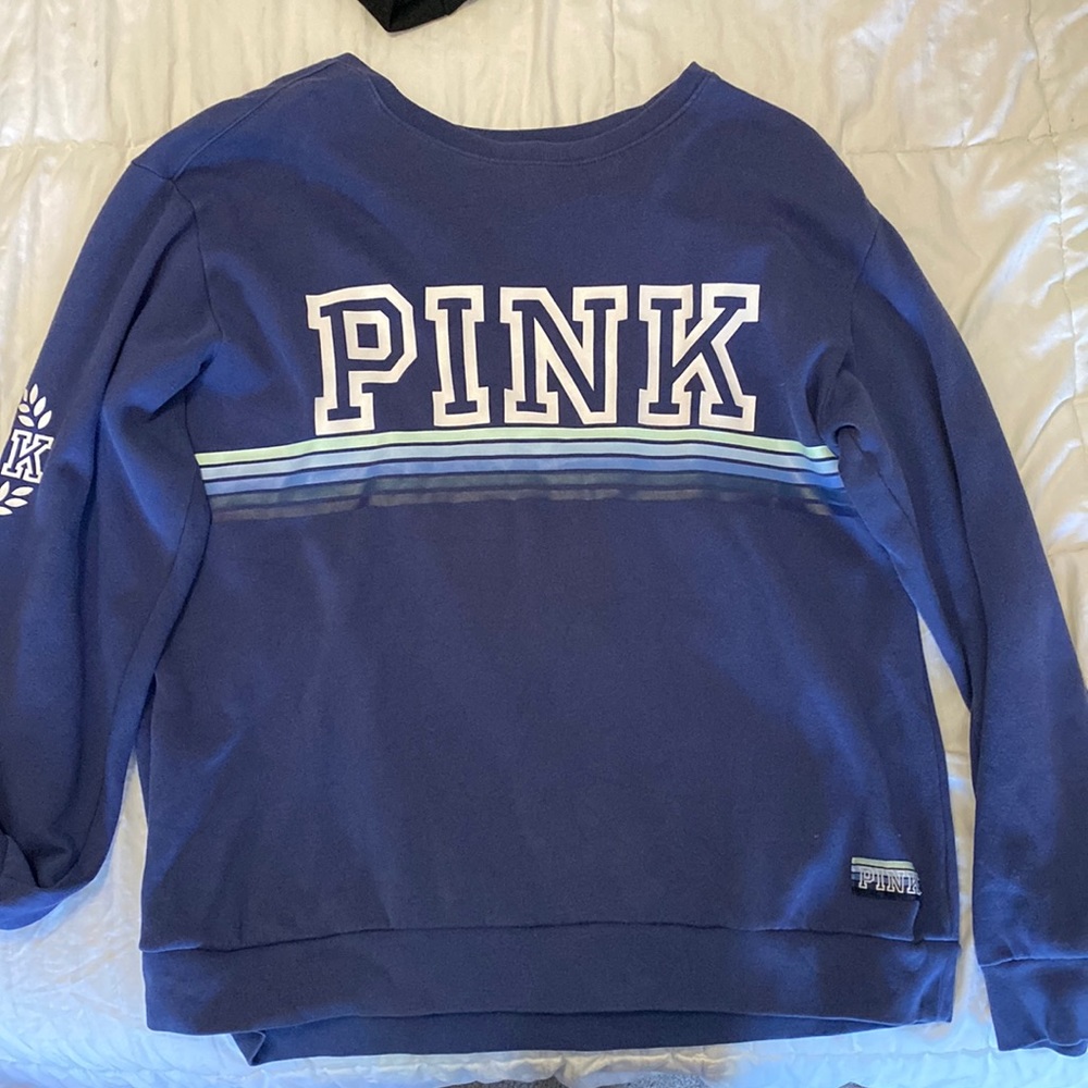 Blue Victoria’s Secret Pink sweatshirt.